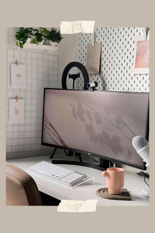 woman sitting at workspace writing about getting website conversions for business growth